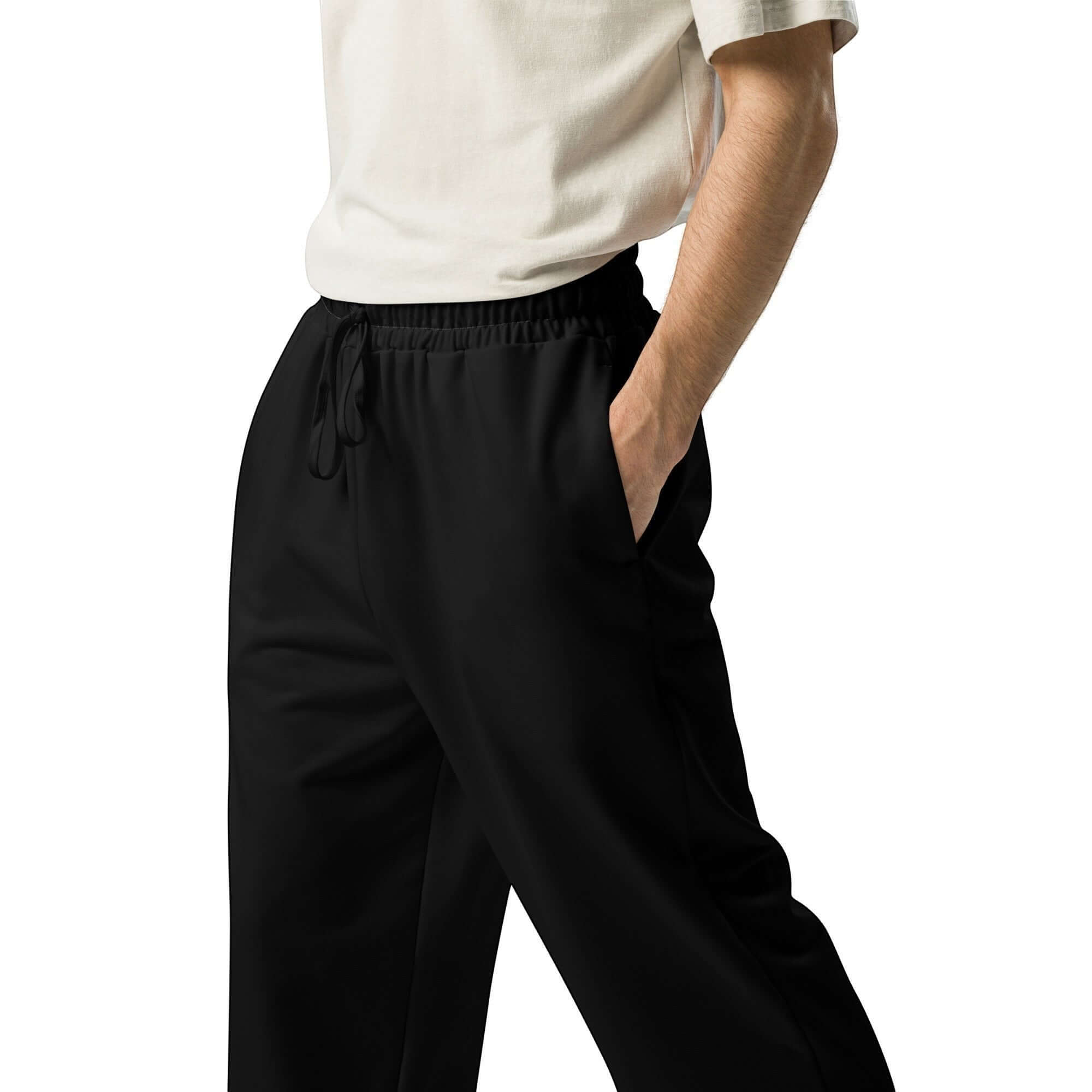 Urban Halo black wide-leg joggers with a drawstring waist, worn by a person in a white t-shirt for a streetwear look.